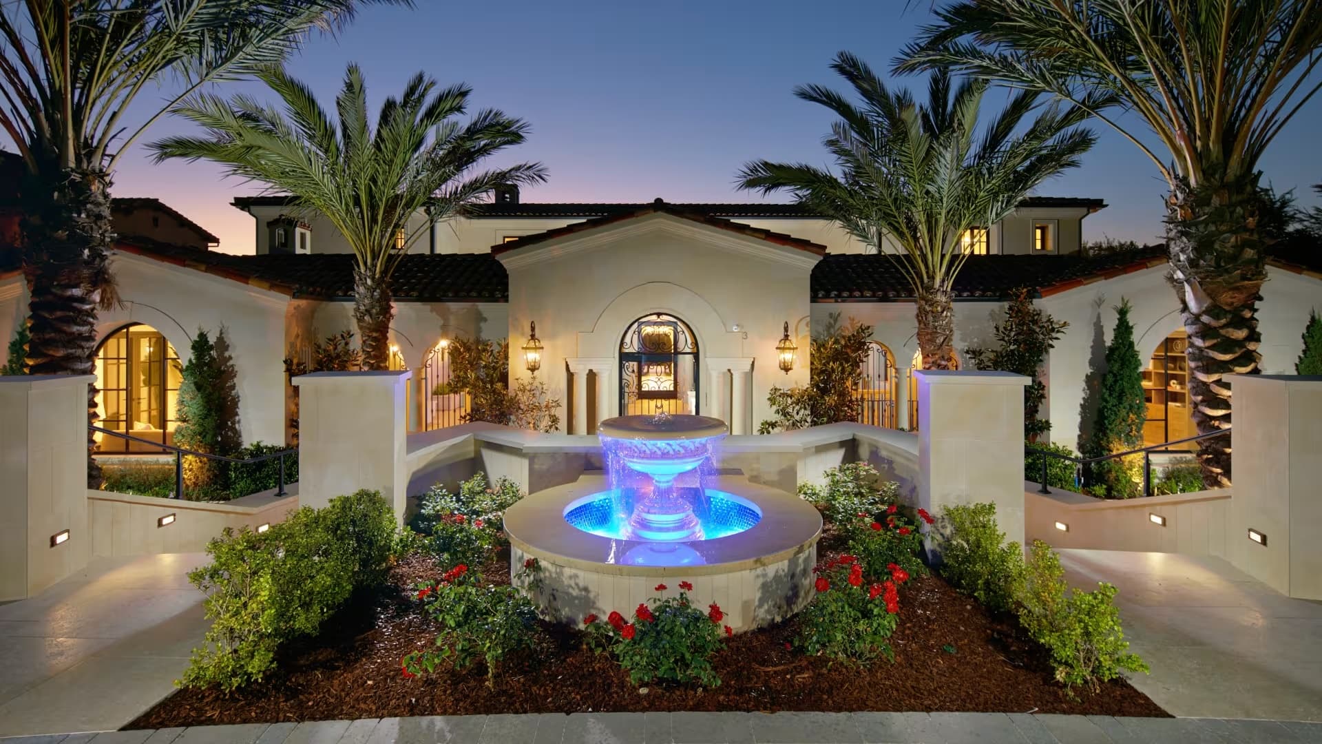 Luxury Orange County estate at dusk with spotless, brightly lit windows